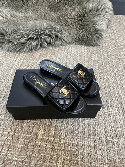 Luxury diamond-quilted flat slides with metal embellishments